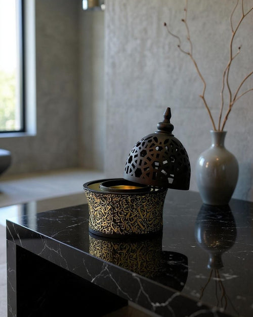 ZYVORA Noor — at home in a minimalist contemporary interior. Black marble, cool light, brushed steel.